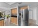 Modern kitchen with stainless steel appliances and light wood cabinets at 20 Sylvia Pl, Oldsmar, FL 34677