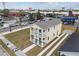 Two-story house with a balcony, driveway, and surrounding landscape at 2204 E 12Th Ave, Tampa, FL 33605