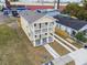 Two-story house with balcony and driveway, next to another house at 2204 E 12Th Ave, Tampa, FL 33605