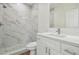 Elegant bathroom with marble shower and white vanity at 2204 E 12Th Ave, Tampa, FL 33605