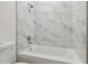 Bathroom with a bathtub and marble tile at 2204 E 12Th Ave, Tampa, FL 33605