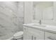 Modern bathroom with marble shower and white vanity at 2204 E 12Th Ave, Tampa, FL 33605