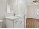 Modern bathroom with white vanity, quartz countertop, and marble-look tile at 2204 E 12Th Ave, Tampa, FL 33605