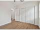 Bright bedroom with vinyl plank flooring and double sliding closet doors at 2204 E 12Th Ave, Tampa, FL 33605