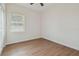 Bright bedroom with ceiling fan and wood-look flooring at 2204 E 12Th Ave, Tampa, FL 33605