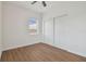 Simple bedroom with wood-look floors and a large closet at 2204 E 12Th Ave, Tampa, FL 33605