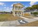 Two-story house with a front porch and driveway at 2204 E 12Th Ave, Tampa, FL 33605