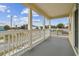 Spacious front porch with white railings and street view at 2204 E 12Th Ave, Tampa, FL 33605