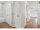 Bright hallway with hardwood floors and white doors at 2204 E 12Th Ave, Tampa, FL 33605