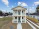 Two-story house with balcony, driveway, and landscaping in front at 2204 E 12Th Ave, Tampa, FL 33605