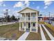 Two-story house with balcony and driveway, located near a busy intersection at 2204 E 12Th Ave, Tampa, FL 33605