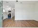 Bright living area with wood-look floors and kitchen access at 2204 E 12Th Ave, Tampa, FL 33605