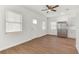 Open living room with wood-look floors and kitchen views at 2204 E 12Th Ave, Tampa, FL 33605