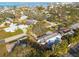 Aerial view showcasing a single-Gathering home's location within a residential neighborhood at 2215 Cedar Dr, Dunedin, FL 34698