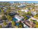 Aerial view of a single-Gathering home with pool, situated in a residential neighborhood near the water at 2215 Cedar Dr, Dunedin, FL 34698