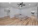 Bright bedroom with ceiling fan, walk-in closet and wood flooring at 2215 Cedar Dr, Dunedin, FL 34698