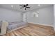 Bedroom with hardwood floors, a ceiling fan, and a bed at 2215 Cedar Dr, Dunedin, FL 34698