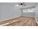 Bright bedroom with hardwood floors and a ceiling fan at 2215 Cedar Dr, Dunedin, FL 34698