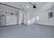 Garage with ample storage, water heater, and interior access at 2215 Cedar Dr, Dunedin, FL 34698