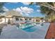 Large pool with patio and deck, perfect for relaxation at 2215 Cedar Dr, Dunedin, FL 34698