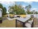 Spacious backyard with patio furniture, fire pit, and grill at 2503 W Crawford St, Tampa, FL 33614