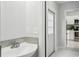 Small bathroom with a sink and a door to the outside at 2503 W Crawford St, Tampa, FL 33614