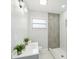 Modern bathroom with gray tile shower and vanity at 2503 W Crawford St, Tampa, FL 33614