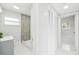 Updated bathroom with walk-in shower, modern vanity, and marble flooring at 2503 W Crawford St, Tampa, FL 33614