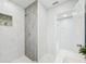 Bathroom with walk-in shower and marble floors at 2503 W Crawford St, Tampa, FL 33614