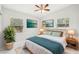 Main bedroom with ceiling fan, and large windows at 2503 W Crawford St, Tampa, FL 33614