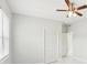 Spacious bedroom with ceiling fan, closet, and marble floors at 2503 W Crawford St, Tampa, FL 33614