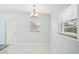 Bright dining area with chandelier and marble floor at 2503 W Crawford St, Tampa, FL 33614