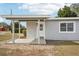 House exterior with covered porch and gray siding at 2503 W Crawford St, Tampa, FL 33614