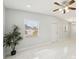 Living room with ceiling fan and large windows at 2503 W Crawford St, Tampa, FL 33614