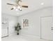 Bright living room with ceiling fan and tile floors at 2503 W Crawford St, Tampa, FL 33614