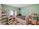 bedroom with a twin bed, changing table, and toy storage at 2606 S Wilder Loop, Plant City, FL 33565