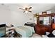 Cozy bedroom with a double bed, dresser, and ceiling fan at 2606 S Wilder Loop, Plant City, FL 33565