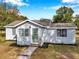 Charming one-story home with a green door and landscaped yard at 2606 S Wilder Loop, Plant City, FL 33565