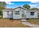 Newly painted house with green door and landscaping at 2606 S Wilder Loop, Plant City, FL 33565