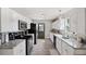 Modern kitchen with white cabinets, stainless steel appliances and a back door at 2606 S Wilder Loop, Plant City, FL 33565