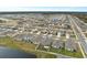 Aerial view of large neighborhood with lake at 2812 Gumbo Limbo Dr, Wimauma, FL 33598