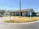 Community clubhouse with benches and parking at 3020 Moss Hill St, Wesley Chapel, FL 33543