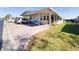 Single-wide mobile home with covered carport and brick paver driveway at 3020 Moss Hill St, Wesley Chapel, FL 33543