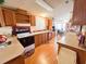 Galley kitchen with wood cabinets and appliances at 3020 Moss Hill St, Wesley Chapel, FL 33543