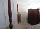 Bedroom with a four poster bed, dresser, doors and carpeted floors at 3060 64Th N Ave, St Petersburg, FL 33702