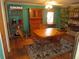 Dining room features a wooden table, chairs, china cabinet, and wood floors at 3060 64Th N Ave, St Petersburg, FL 33702