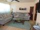 Living room featuring tile flooring, two couches, a glass table, and neutral wall paint at 3060 64Th N Ave, St Petersburg, FL 33702