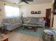 Warm living room featuring neutral couches, decorative pillows, and a glass coffee table at 3060 64Th N Ave, St Petersburg, FL 33702