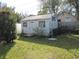 View of the back yard featuring a small, white shed at 3060 64Th N Ave, St Petersburg, FL 33702