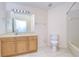 Clean bathroom with wood vanity and tiled floors at 30817 Prout Ct, Wesley Chapel, FL 33543